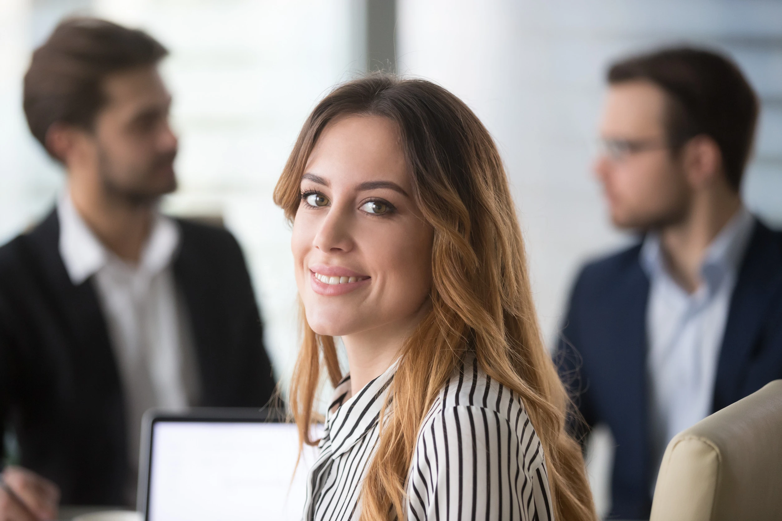 Portrait of beautiful smiling female worker or company manager looking at camera posing, pretty woman partner headshot picture during corporate meeting or negotiations in office